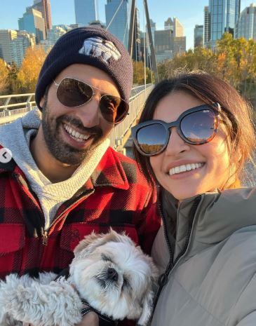 Bharat Rishi Moorjani with his wife Richa Moorjani and dog in Canada